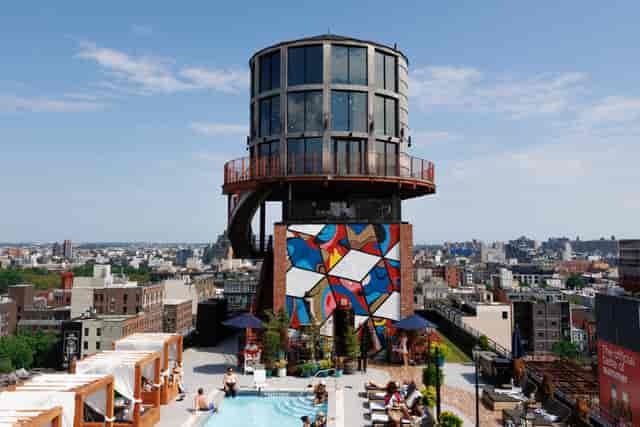 Rooftop pool and lounge in Arlo Williamsburg with city views, ideal for events and gatherings.