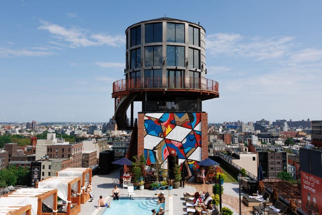 Rooftop pool and lounge in Arlo Williamsburg with city views, ideal for events and gatherings.