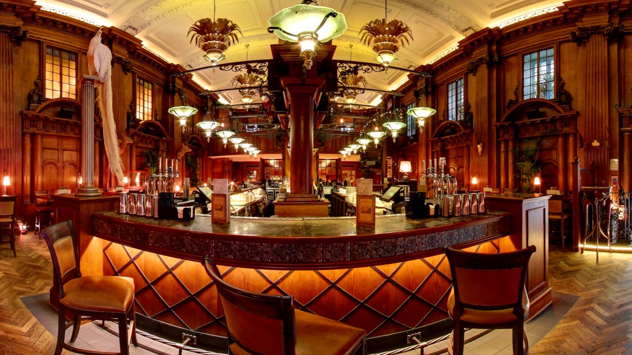 Live music bar with rich wood interiors, ideal for upscale events and gatherings. - Banner