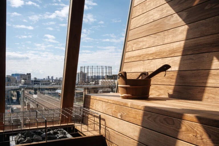 Cosy booth seating in modern Netil360 Rooftop Bar for meetings and wellness retreats.