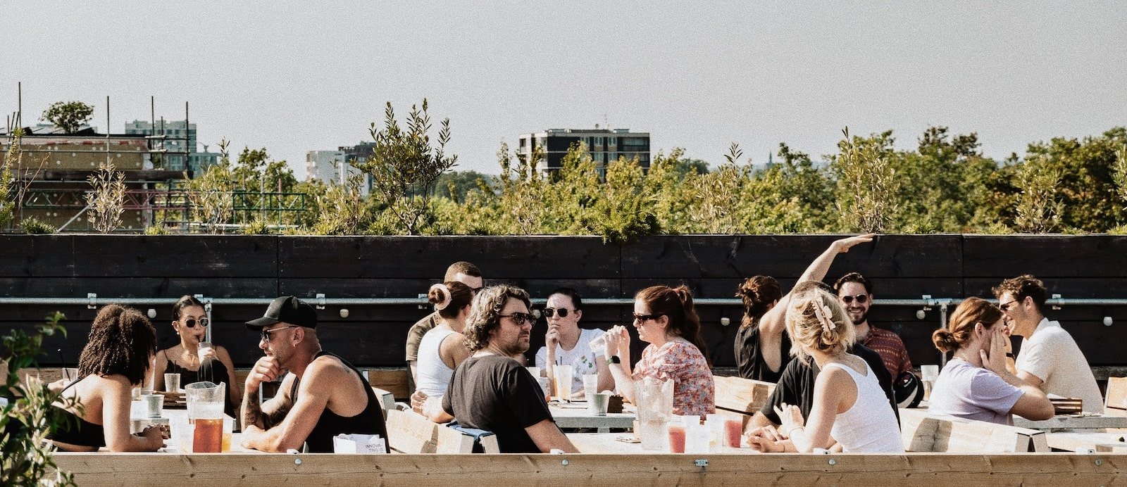 Cosy booth seating at Netil360 Rooftop Bar for summer networking events. - Banner