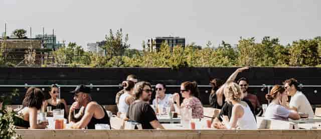 Cosy booth seating at Netil360 Rooftop Bar for summer networking events.