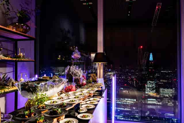 Elegant buffet setup at The Lookout, 8 Bishopsgate for corporate events with city skyline.