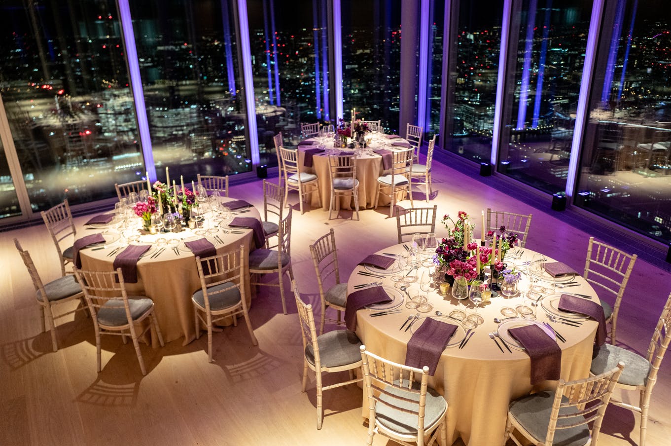 Elegant event space at The Lookout, 8 Bishopsgate, with gold linens and cityscape views.