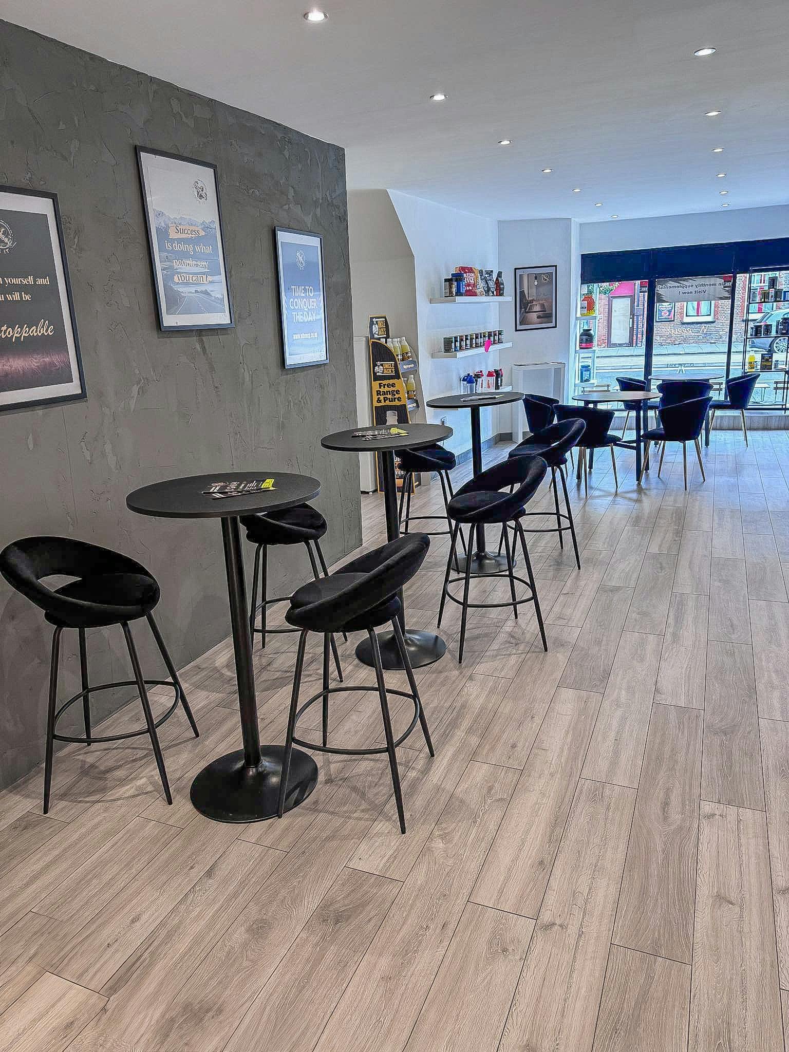 Modern event space with high-top tables, ideal for networking and casual meetings.