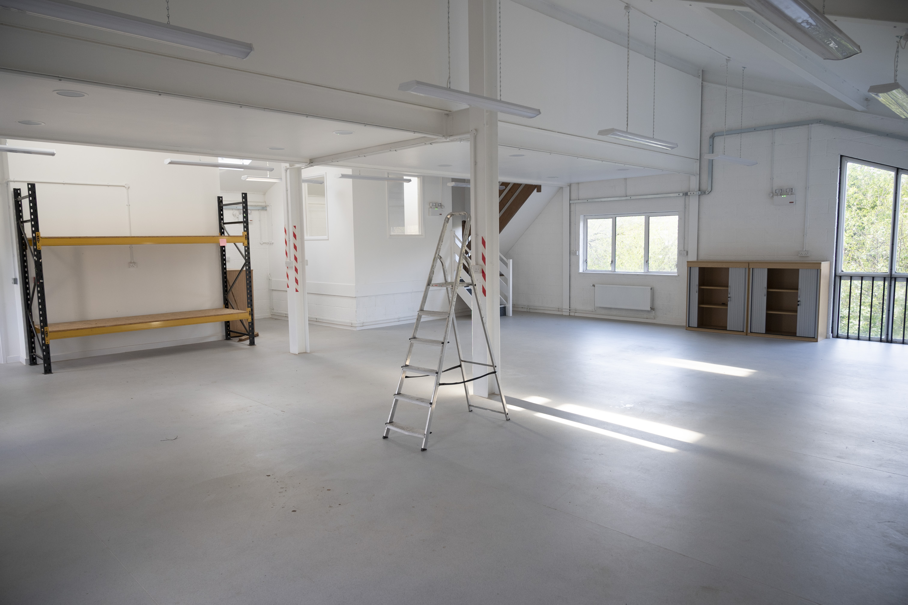 Versatile event space with natural light, ideal for meetings and workshops at Roseberry Road Studios. - Banner