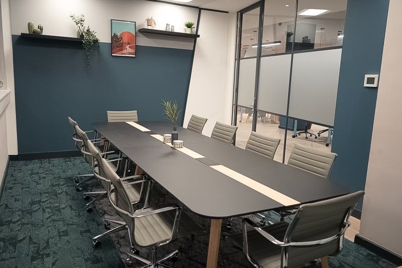 Modern conference room with elongated table for productive meetings and brainstorming.