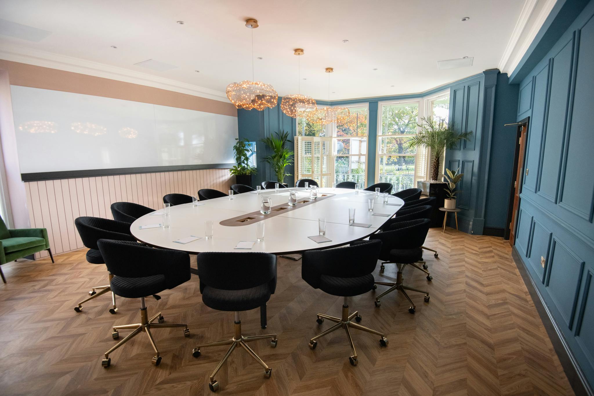 Duchy Suite meeting room with oval table, ideal for collaborative sessions and brainstorming.