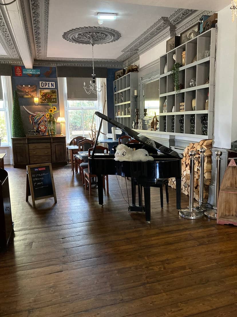 Charming Armstrong Manor bar with grand piano, perfect for intimate events and receptions.