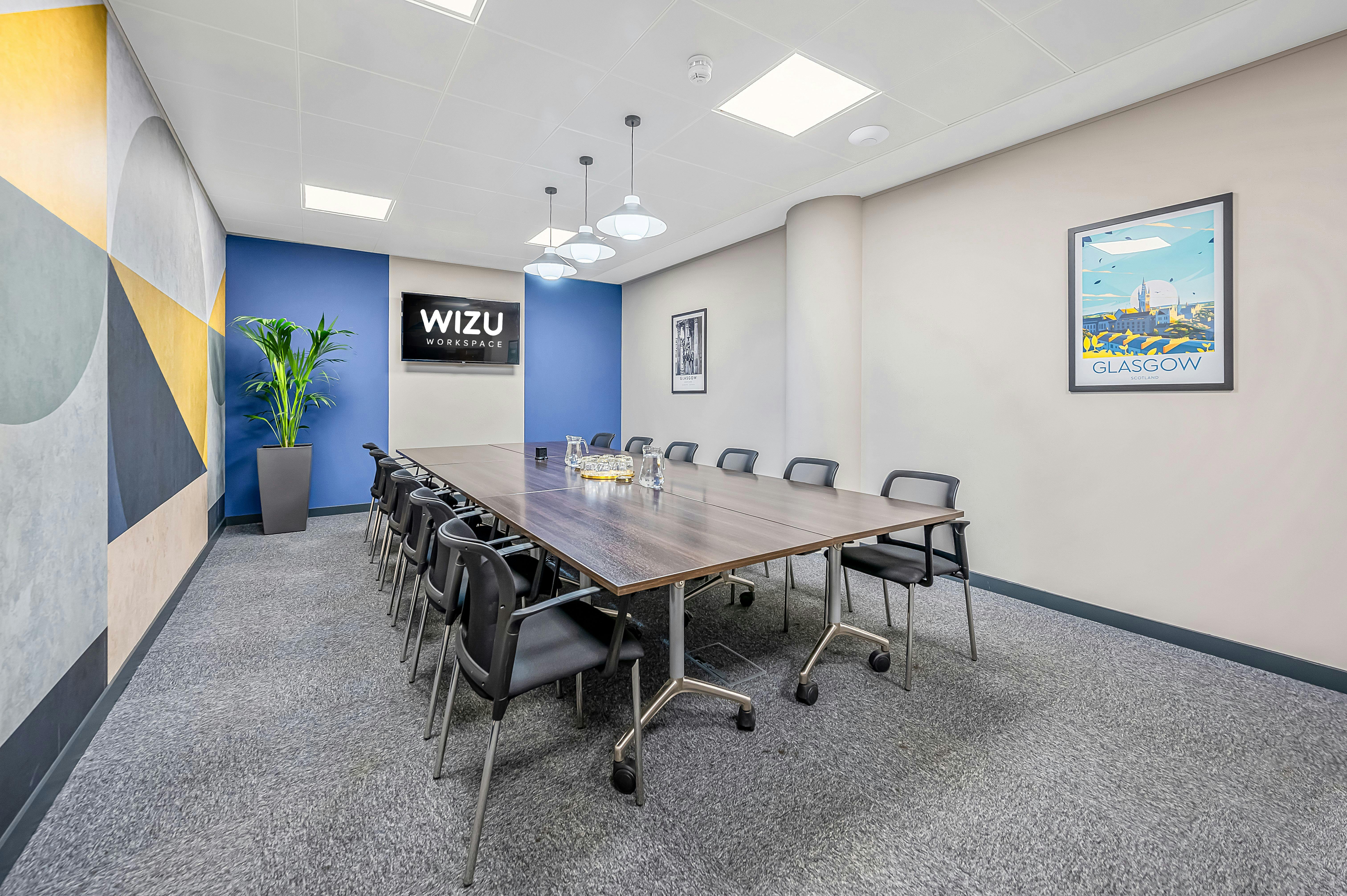 Modern meeting room in Wizu Workspace with sleek table, ideal for collaboration and brainstorming.