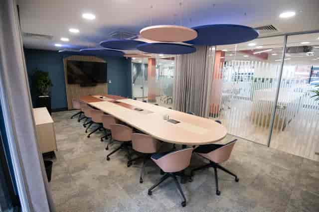 Millennium Suite boardroom: modern ergonomic design for professional strategy meetings and events.
