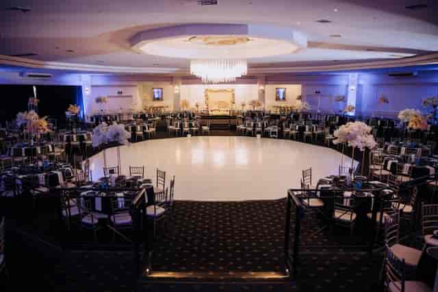 Elegant Pearl Ballroom with circular stage, ideal for galas and award ceremonies.