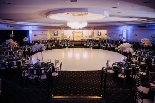 Elegant Pearl Ballroom with circular stage, ideal for galas and award ceremonies.
