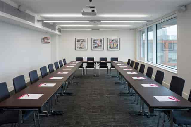 Meeting room in Etc.venues Manchester, U-shaped setup for workshops and strategic meetings.