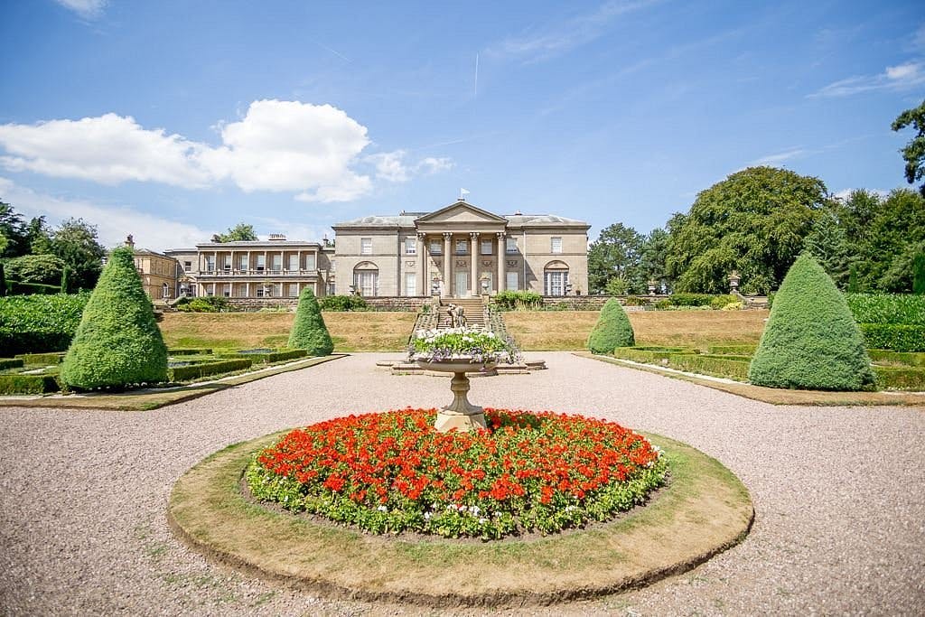 Tatton Park courtyard with manicured gardens, perfect for outdoor weddings and events.