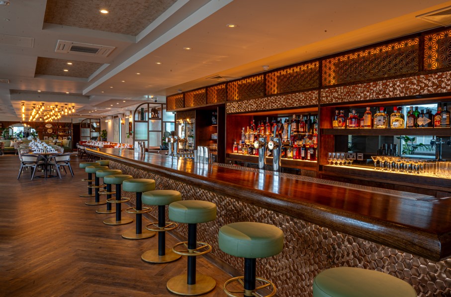 Stylish bar area in Kitty Hawk, ideal for networking events and cocktail receptions. - Banner
