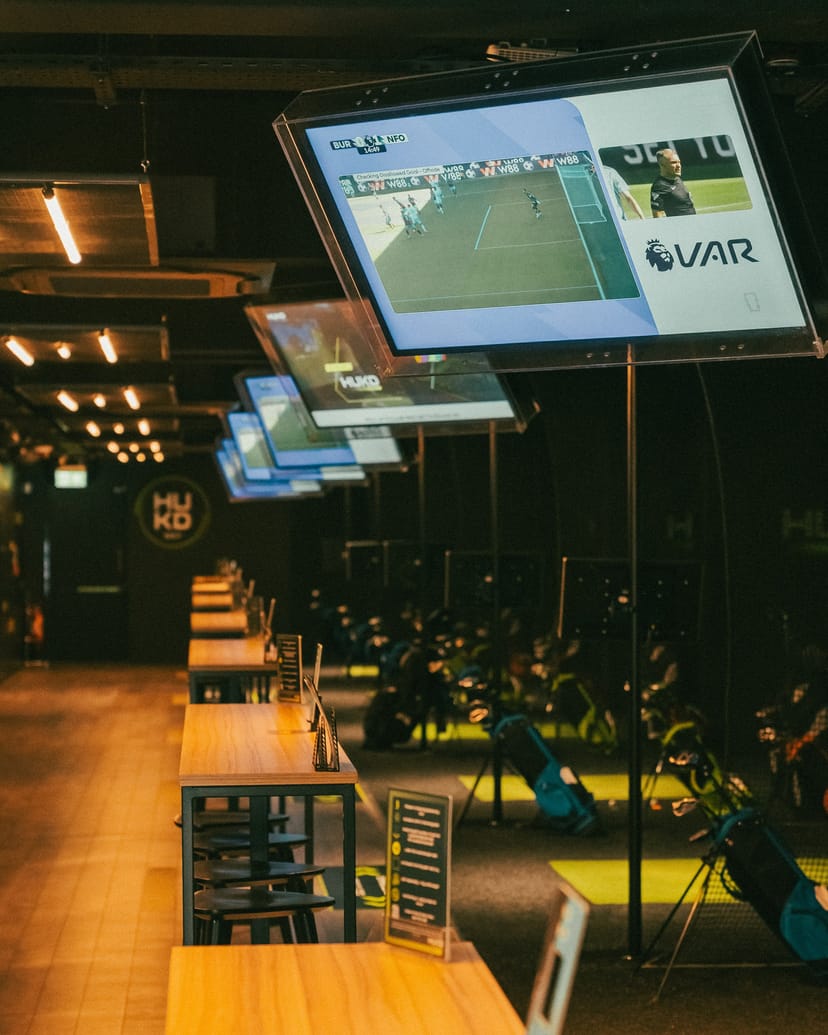 HUKD indoor golf simulator setup for corporate events and private parties.