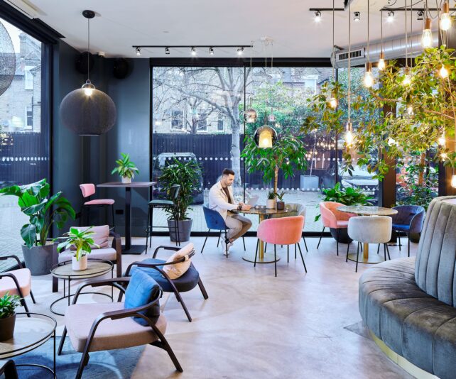 Modern meeting space in Fulham with greenery, ideal for creative brainstorming events. - Banner