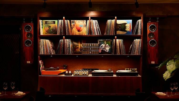 Stylish audio setup with vinyl records in Caia London for intimate gatherings and events.