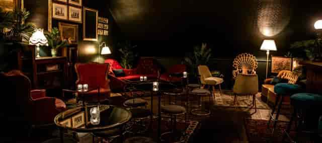 Stylish Green Room lounge in Caia London, ideal for networking events and gatherings.