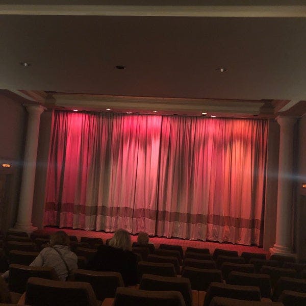 Curzon Richmond Cinema stage with vibrant curtain for upcoming performance event.