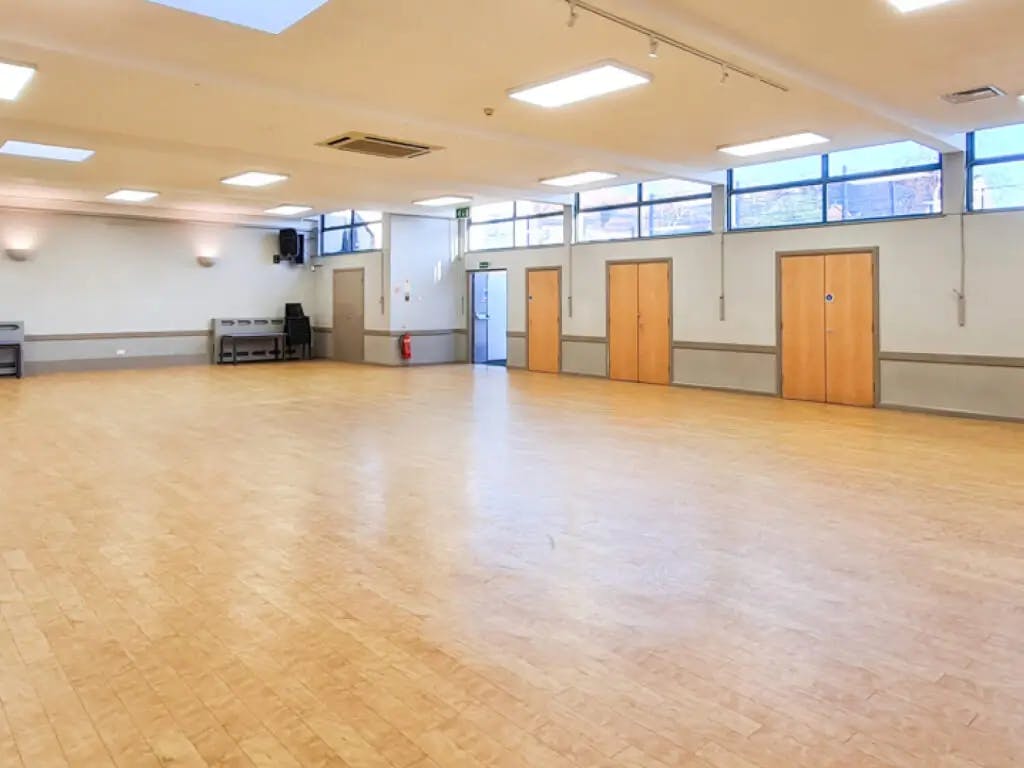 Spacious, well-lit interview room at Barnsbury Community Centre for meetings and events.