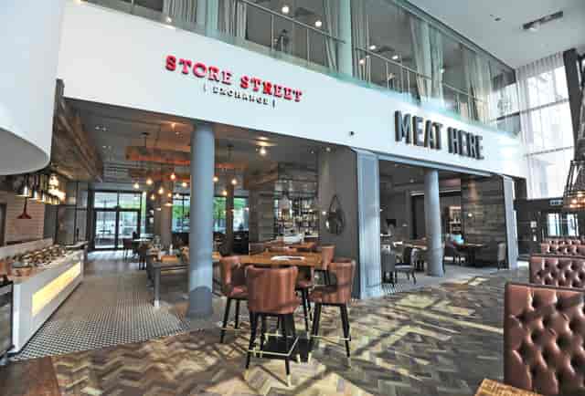 Ground Floor Terrace at DoubleTree Manchester, modern dining space for events and gatherings.
