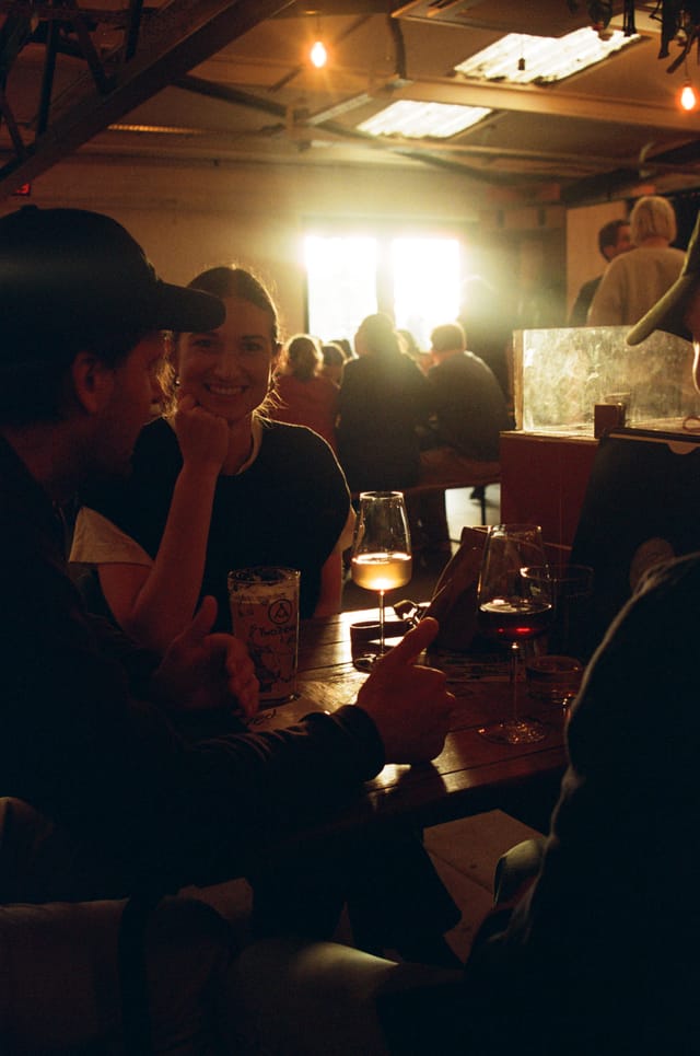 Hackney Wick Hangout at The Cause, warm lighting, networking event for community engagement.