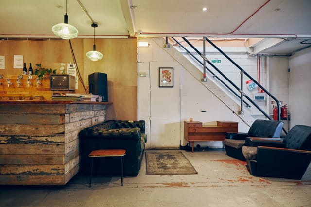 Cozy Hackney Wick Hangout with rustic bar, perfect for casual gatherings and networking.