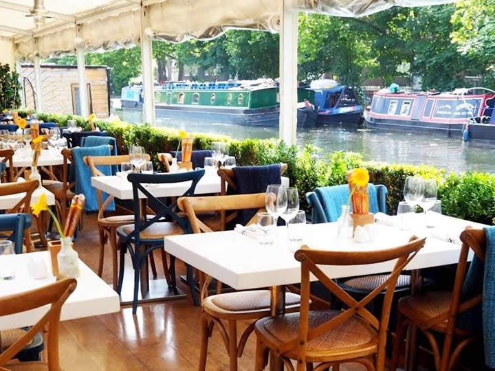 Riverside restaurant venue with flexible seating for intimate gatherings and corporate events.