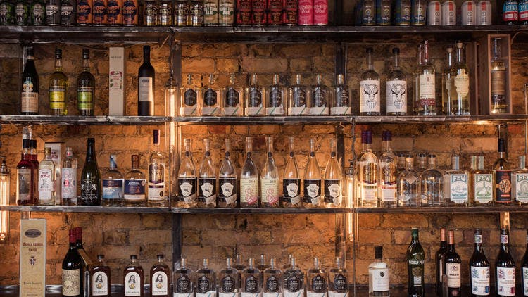Bottle Shop in The Distillery London, rustic bar with spirits, perfect for networking events.