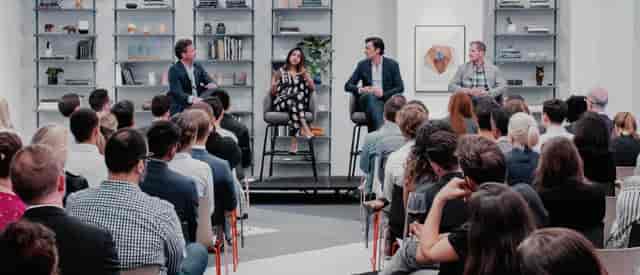 Panel discussion at The Forum, Convene Philadelphia, featuring diverse speakers and engaged audience.