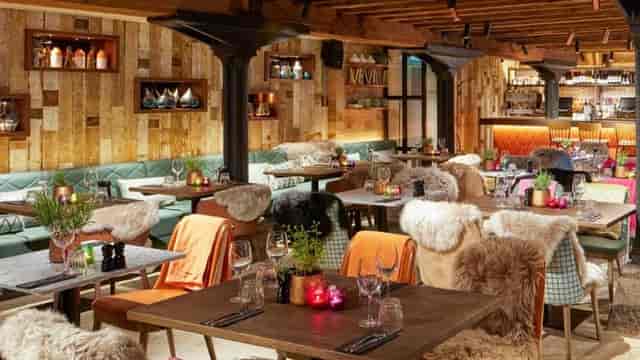 Cozy dining area with warm wood accents, perfect for intimate gatherings and events.