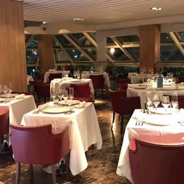 Elegant dining space with ambient lighting for intimate gatherings and corporate dinners.