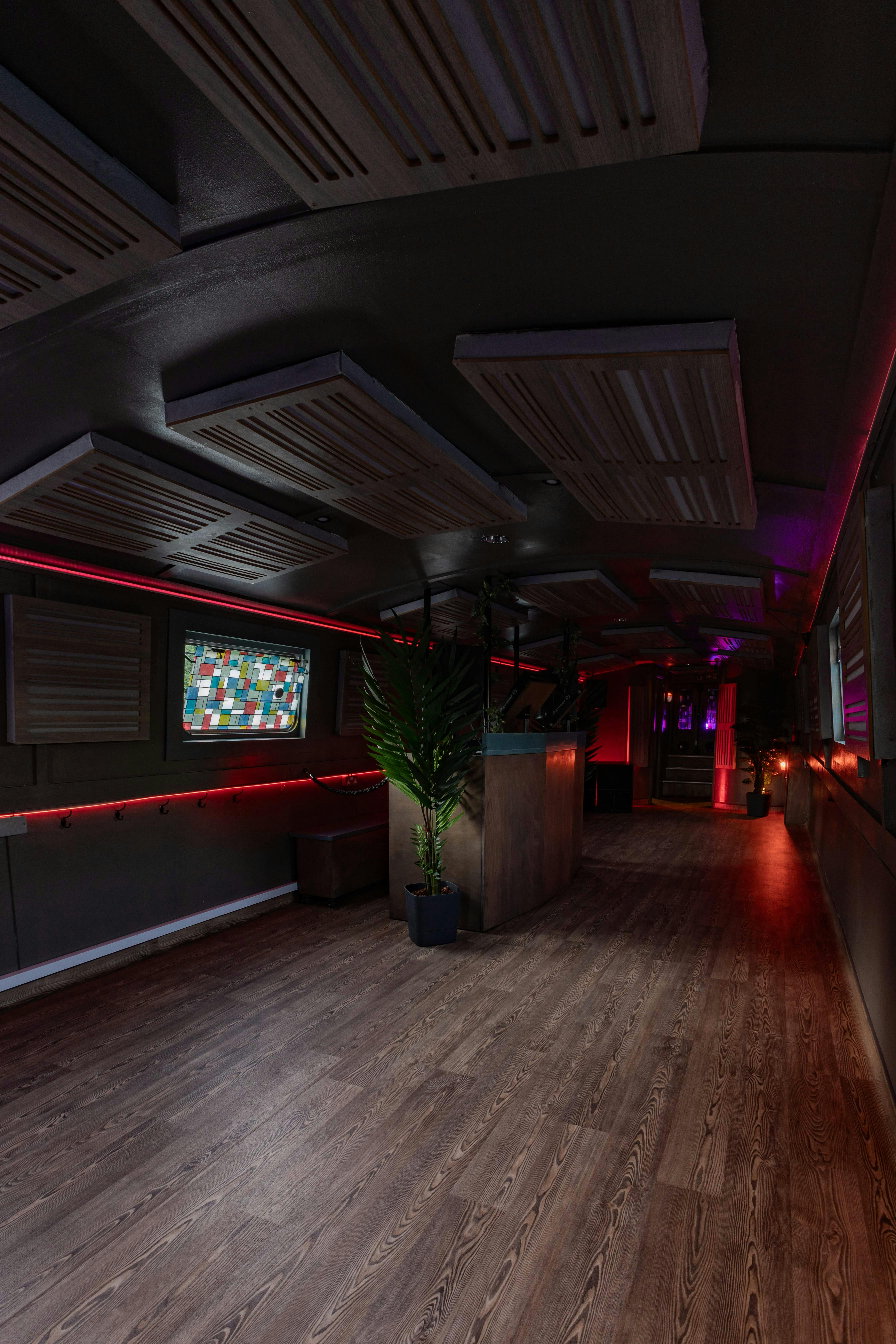 Floating mobile event space with ambient lighting, perfect for networking and gatherings.