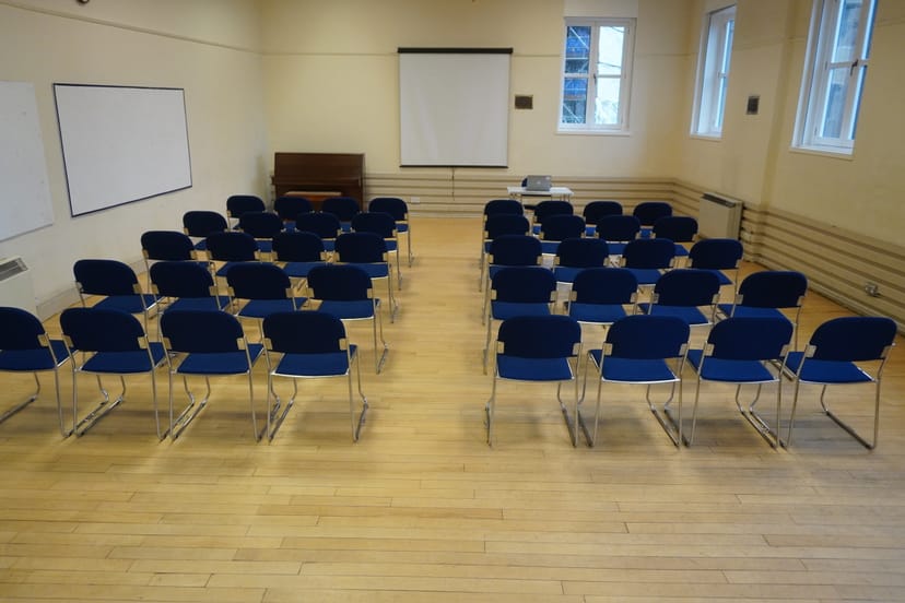Edinburgh Quaker Meeting House Hall with blue chairs for engaging workshops and presentations.
