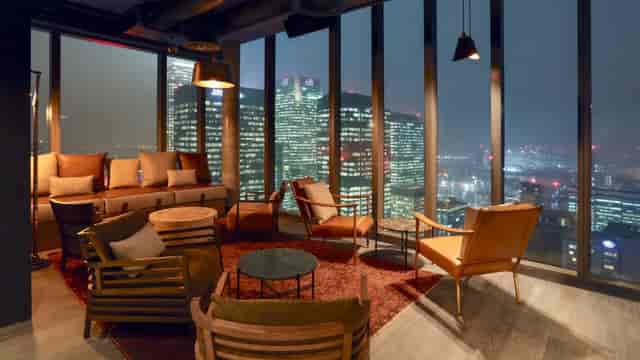 Stylish Bōkan 38 Bar with panoramic city views, perfect for corporate events and gatherings.