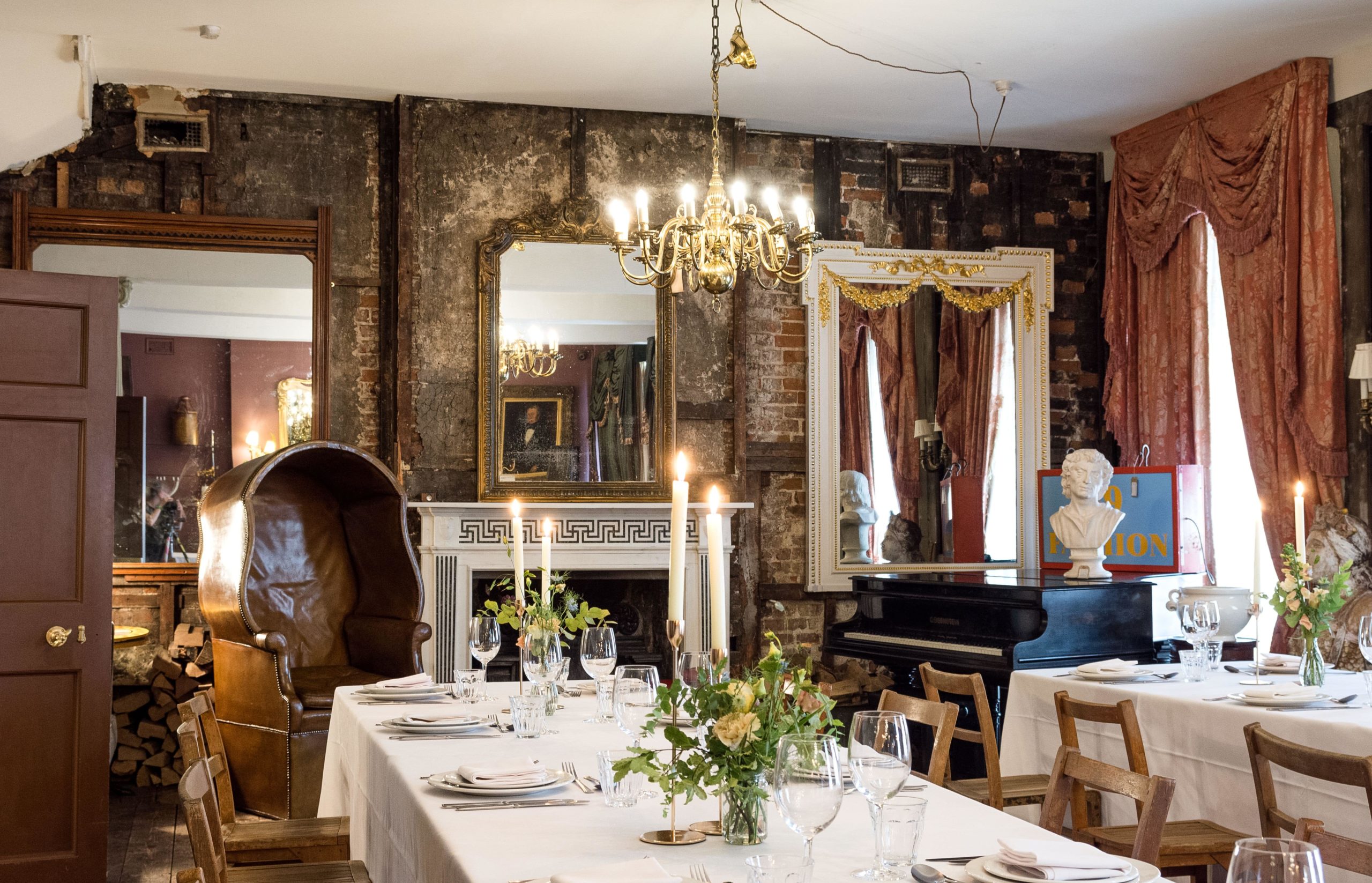 Elegant dining room with chandelier for intimate gatherings and upscale events. - Banner