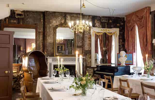 Elegant dining room with chandelier for intimate gatherings and upscale events.