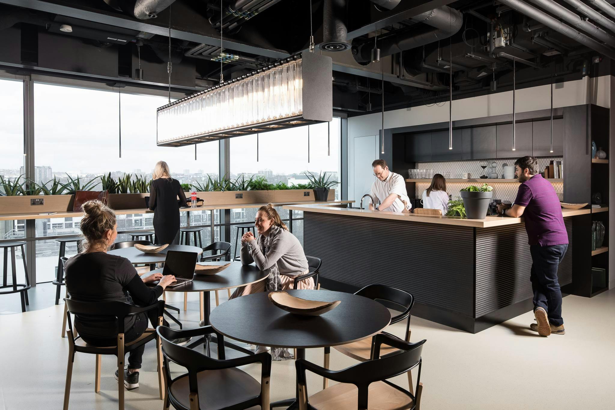 Rooftop terrace kitchen lounge for networking events and team-building activities.