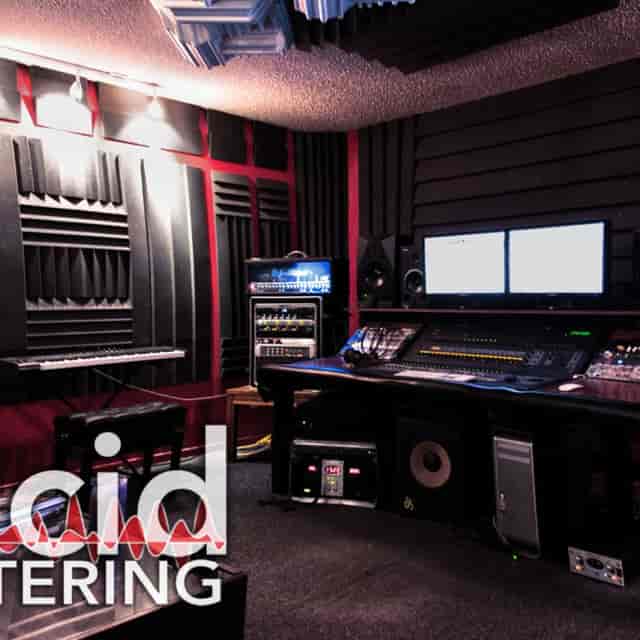 Professional audio recording studio with soundproofed walls for music production workshops.