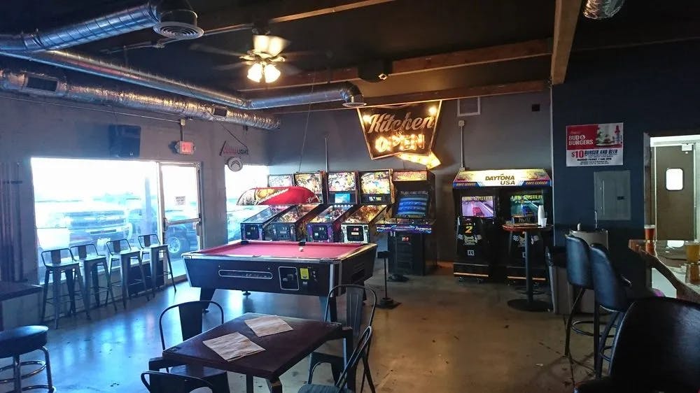 Arcade games and pool table in Brewskis Bar, perfect for team-building events.