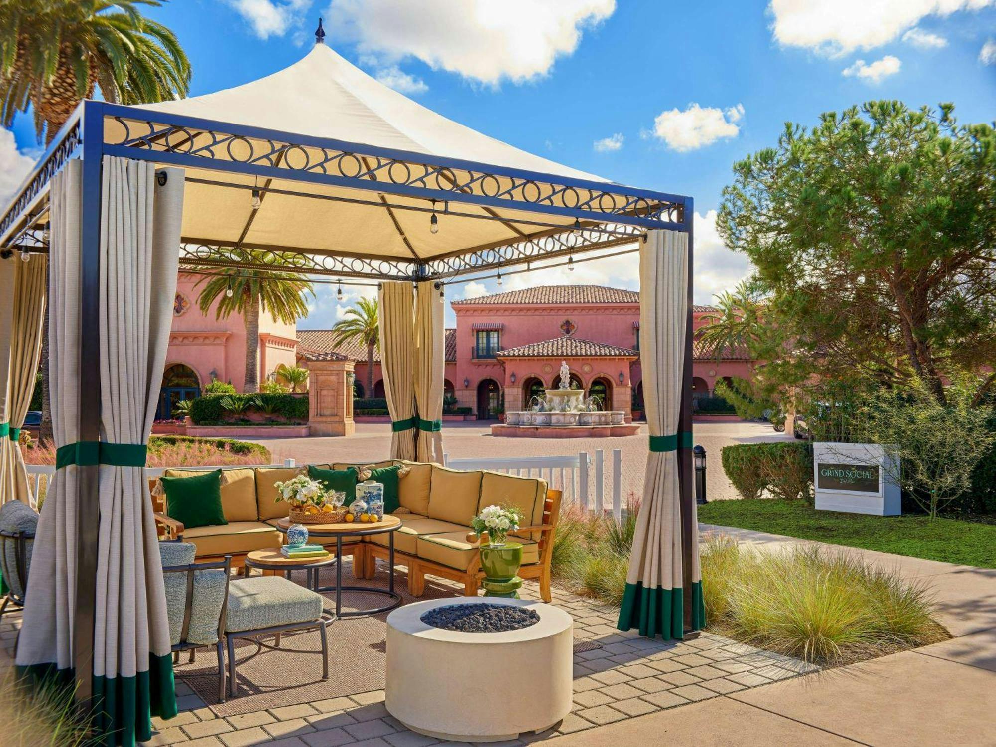 Outdoor lounge area in Del Mar Social, featuring elegant tent and stylish seating for events.
