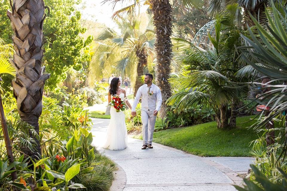 Catamaran Resort wedding venue with lush greenery and vibrant flowers for outdoor ceremonies.