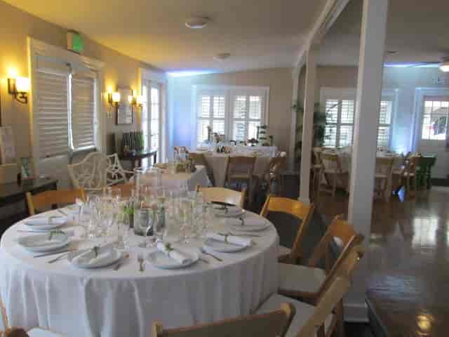MBWC Clubhouse event space with elegantly set tables for gatherings and formal dinners.