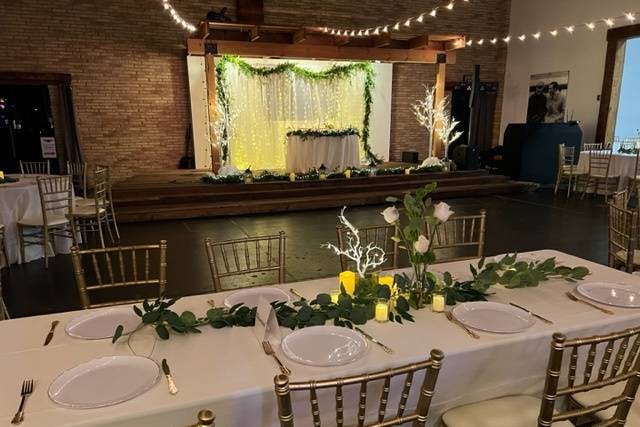 Elegant banquet hall with gold chiavari chairs, ideal for weddings and formal events.