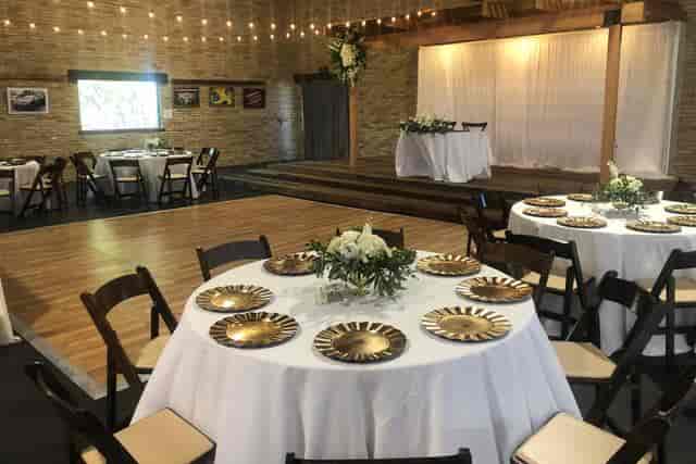 Elegant banquet hall with floral centerpieces, perfect for weddings and corporate events.