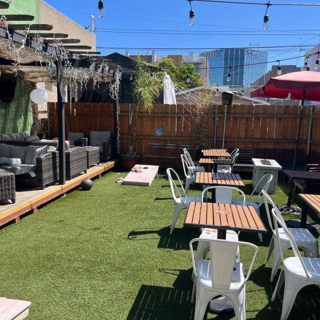 Outdoor event space at U31 Bar with artificial grass, ideal for gatherings and social events.