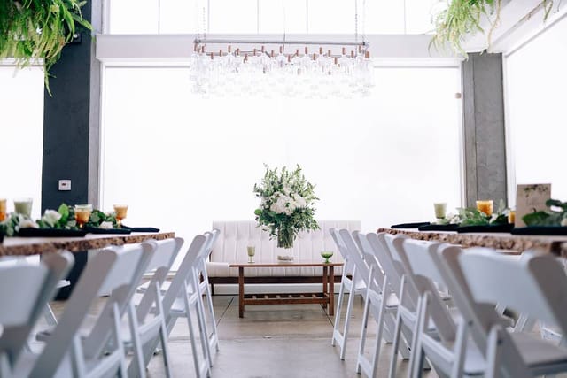 Elegant event space at Kombuchery with floral centerpiece, perfect for gatherings and meetings.