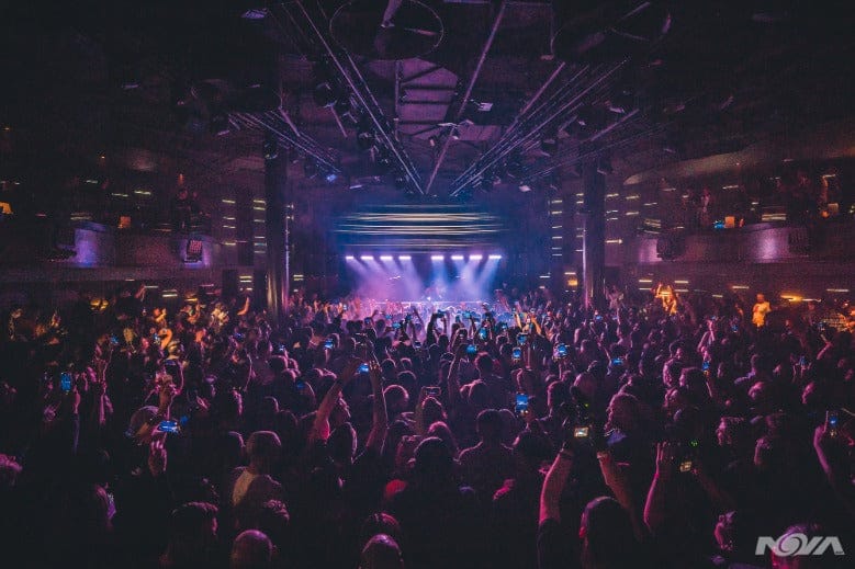 Vibrant live event at NOVA SD with dynamic lighting and engaged audience.